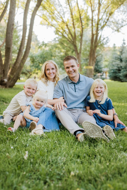 Lehi, UT dentist Dr. Stringam and his wife pose for a family photo with their three children